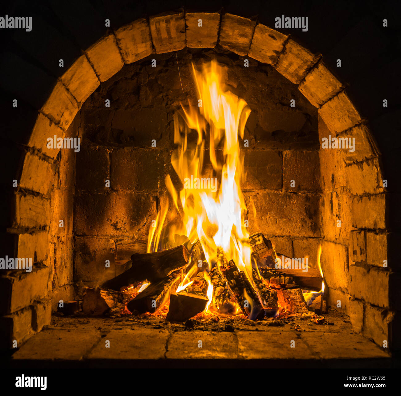 Wood Burning In A Cozy Fireplace At Home Keep Warm Stock Photo