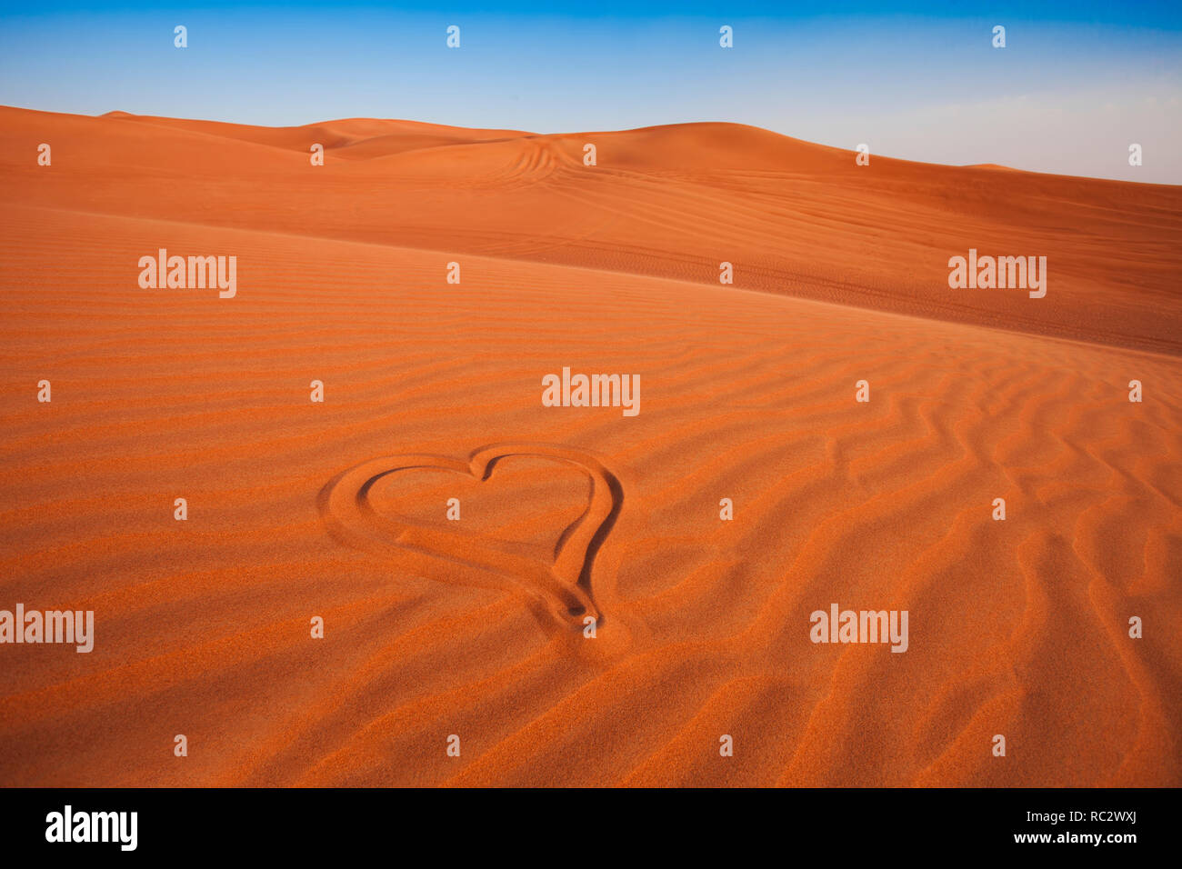 drawing of romantic heart in the arabic sand desert. love concept Stock  Photo - Alamy, image size:1300x956