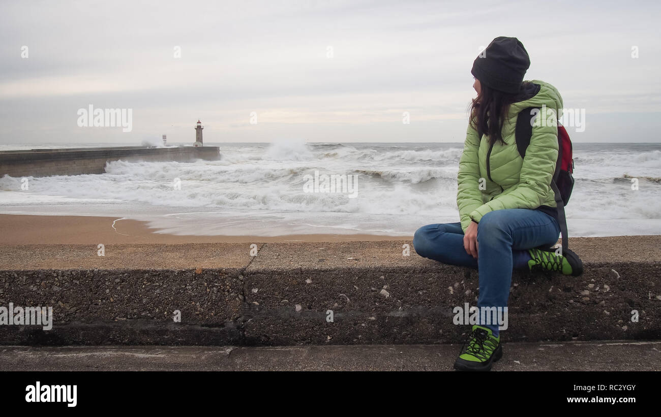 Girl watching the waves hi-res stock photography and images - Alamy