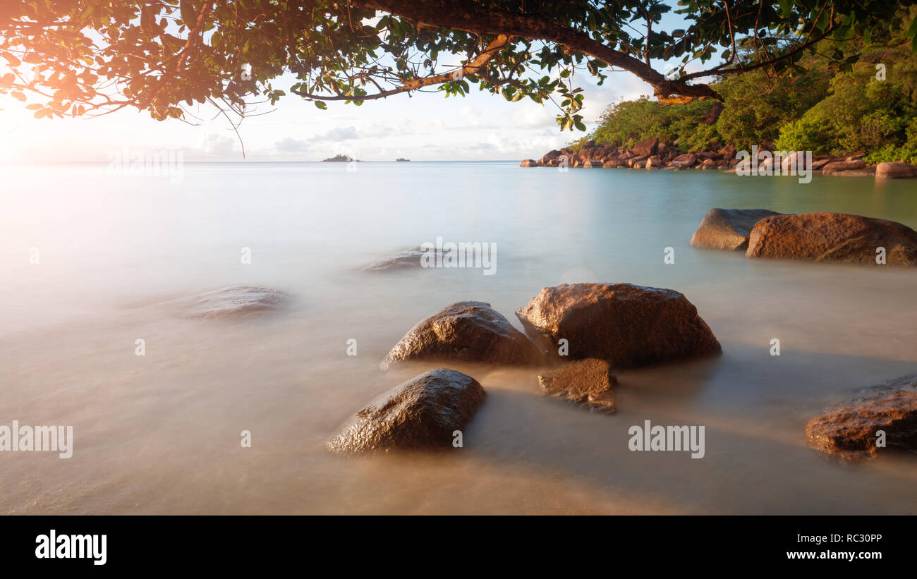 Art Beautiful sunset over the tropical beach Stock Photo - Alamy