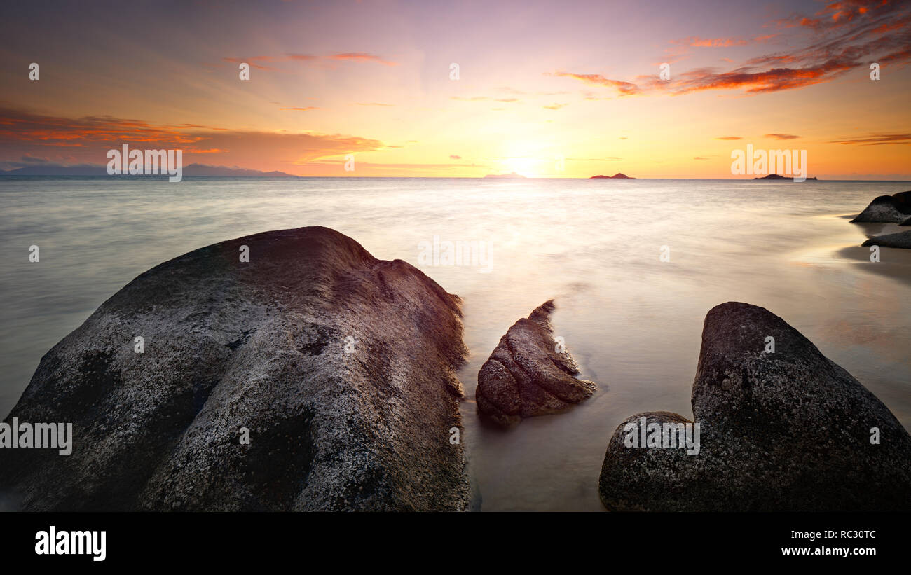 Art Beautiful sunset over the tropical beach Stock Photo - Alamy