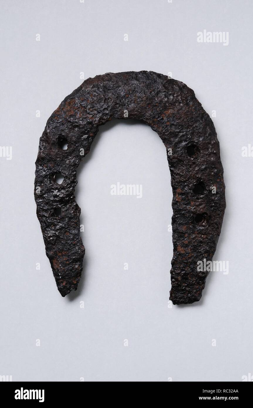 Iron horseshoe .Height 120 mm Thickness 4 mm. ( 4th- 8th CE ) - Roman period, from the ' South Baths '- Archaeological site of Complutum in Alcalá de Henares ( Madrid ). SPAIN. Stock Photo