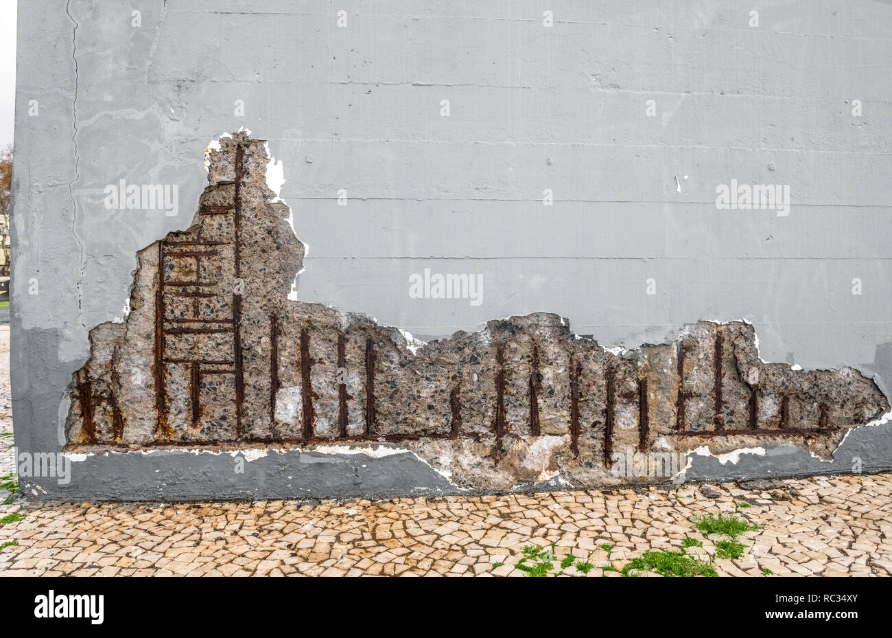 Reinforced concrete erosion due to exposed steel bars to bad weather. Stock Photo