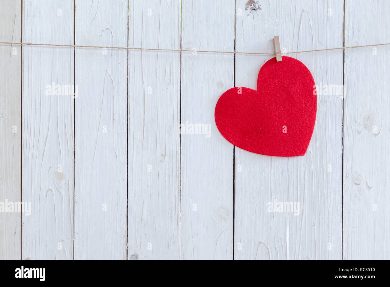 Red heart hanging on white wood background with copy space Stock Photo ...
