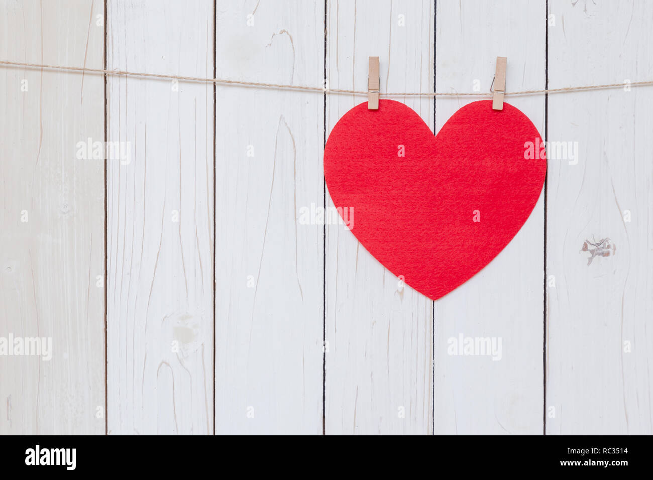 Red heart hanging on white wood background with copy space Stock Photo ...
