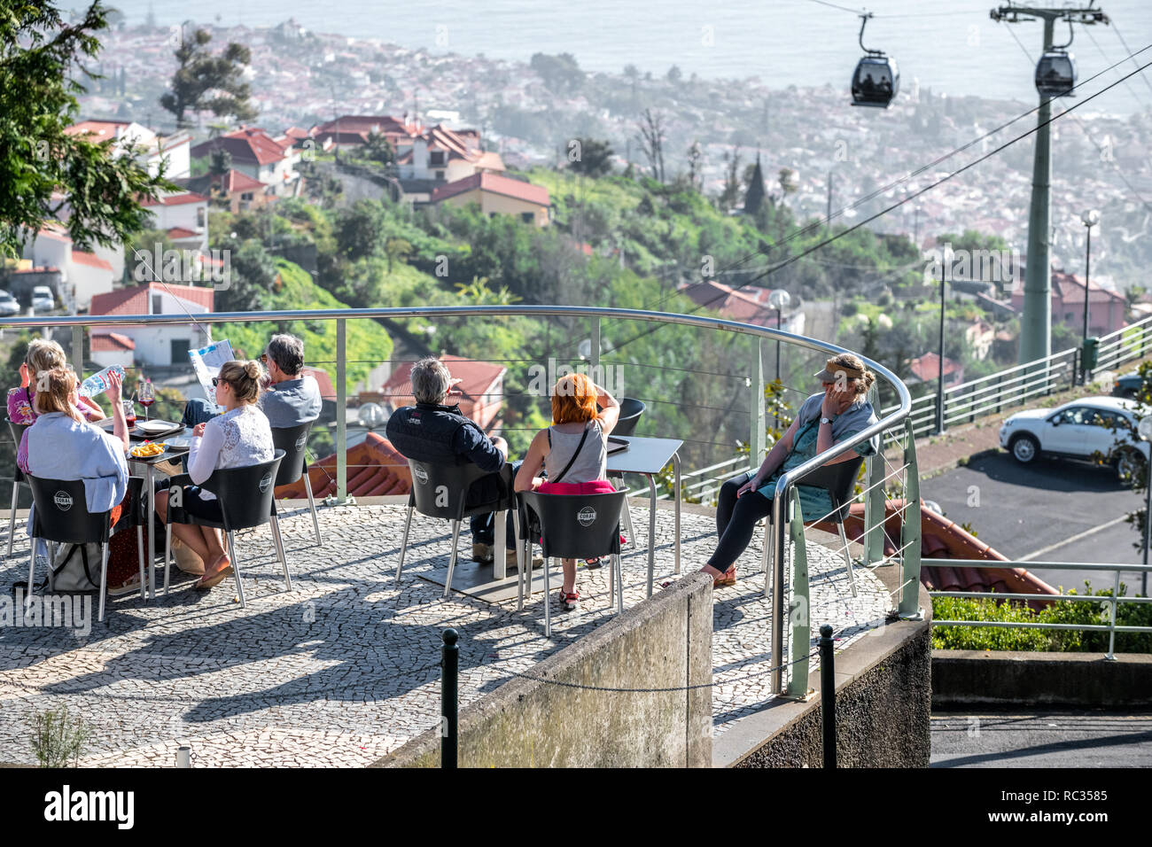Tourist relaxing at the Cafe Do Monte in Funchal, Madeira. Stock Photo