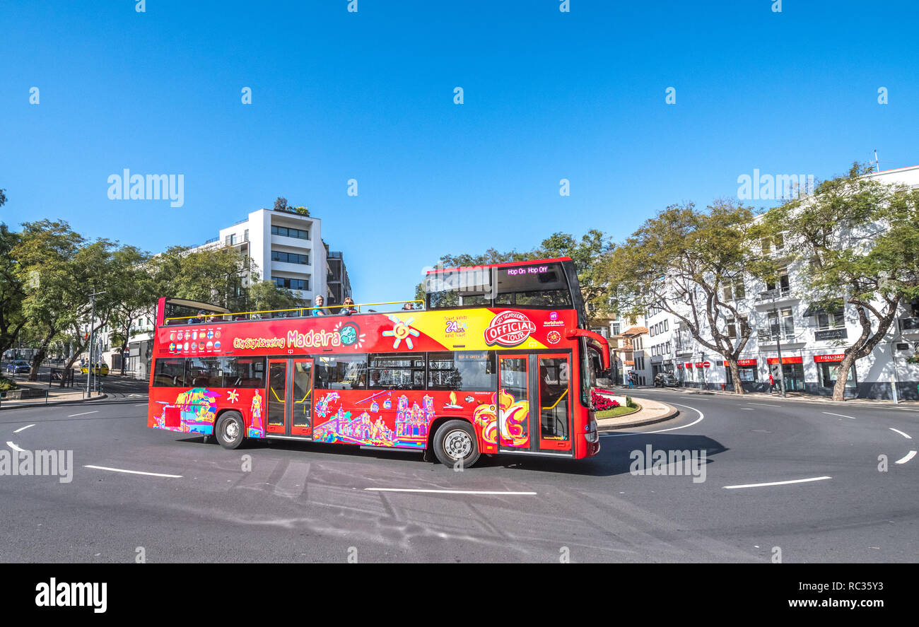 The Madeira open top 'hop on hop off' tourist double decker bus at a stop in Funchal, Madeira.. Stock Photo