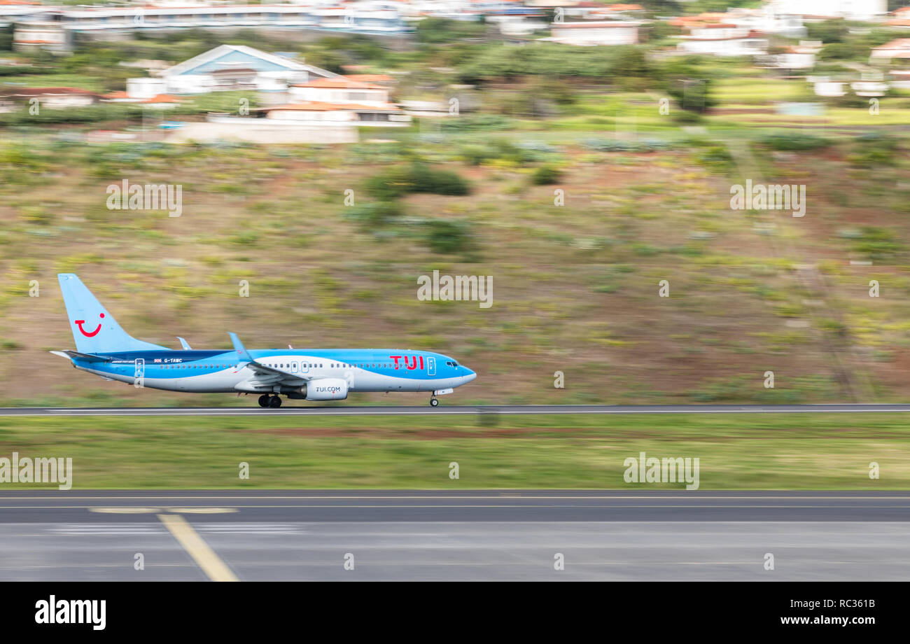 TUI Boeing G-TAWC 737-800 taking off at Madeira International Airport Cristiano Ronaldo CR7. Stock Photo