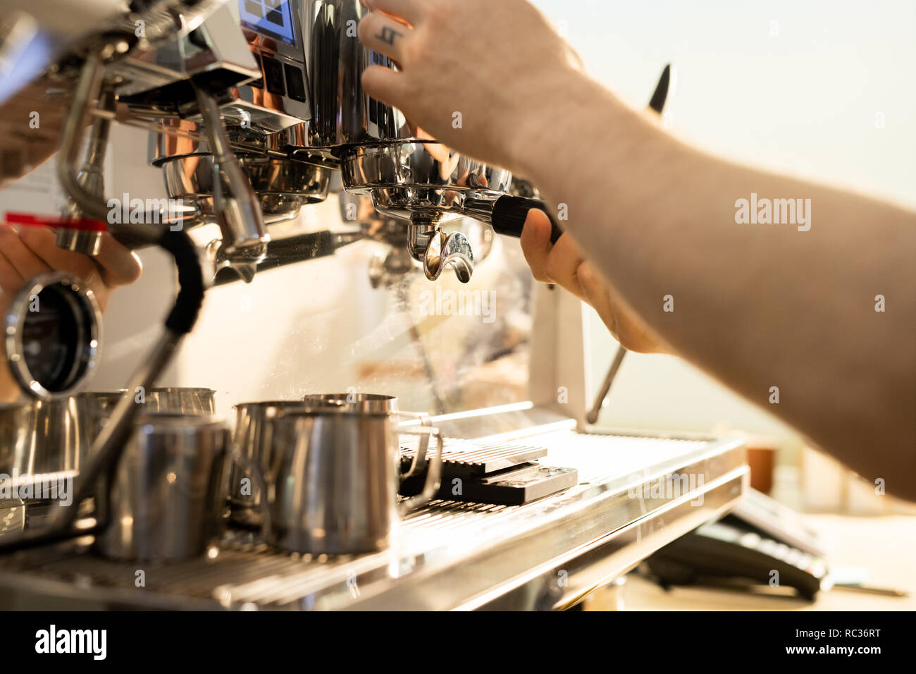 Barista brewing coffee using espresso machine Stock Photo Alamy