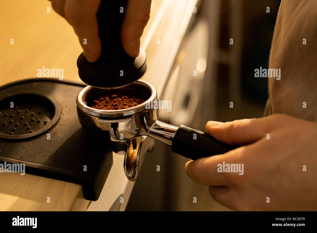 Barista making coffee pressing hi-res stock photography and images - Alamy