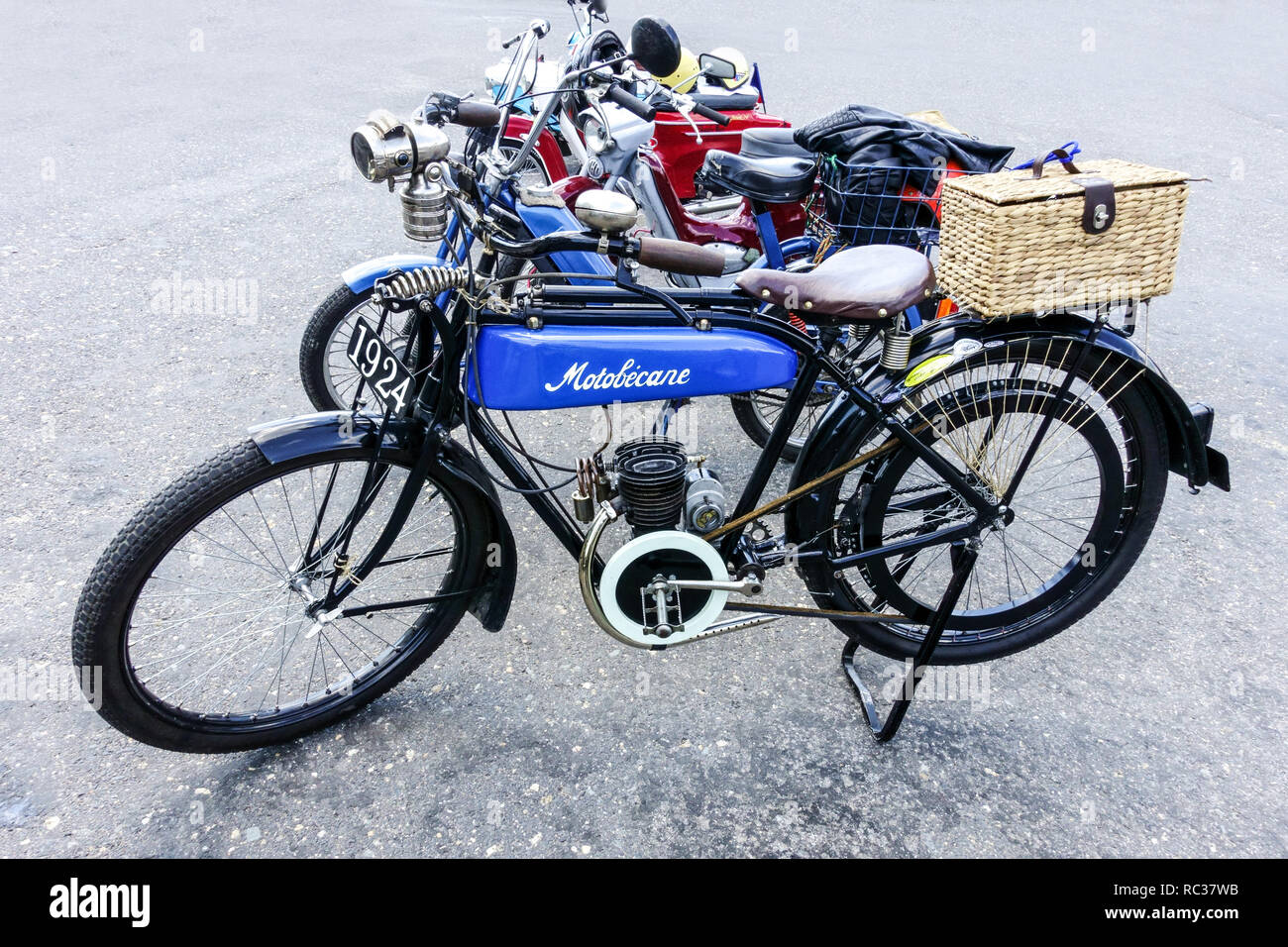 peugeot 103 sp chooper and mbk 51 motobecane caferacer french vintage retro  moped in style custom and racing parked in city street Photos
