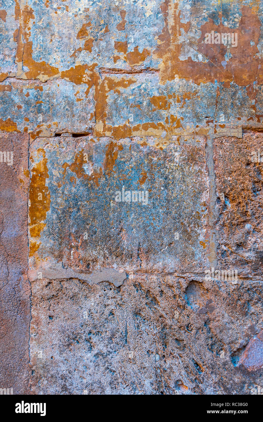 Rusted stone wall. Aged Mediterranean stone wall. Medieval architecture. Stock Photo