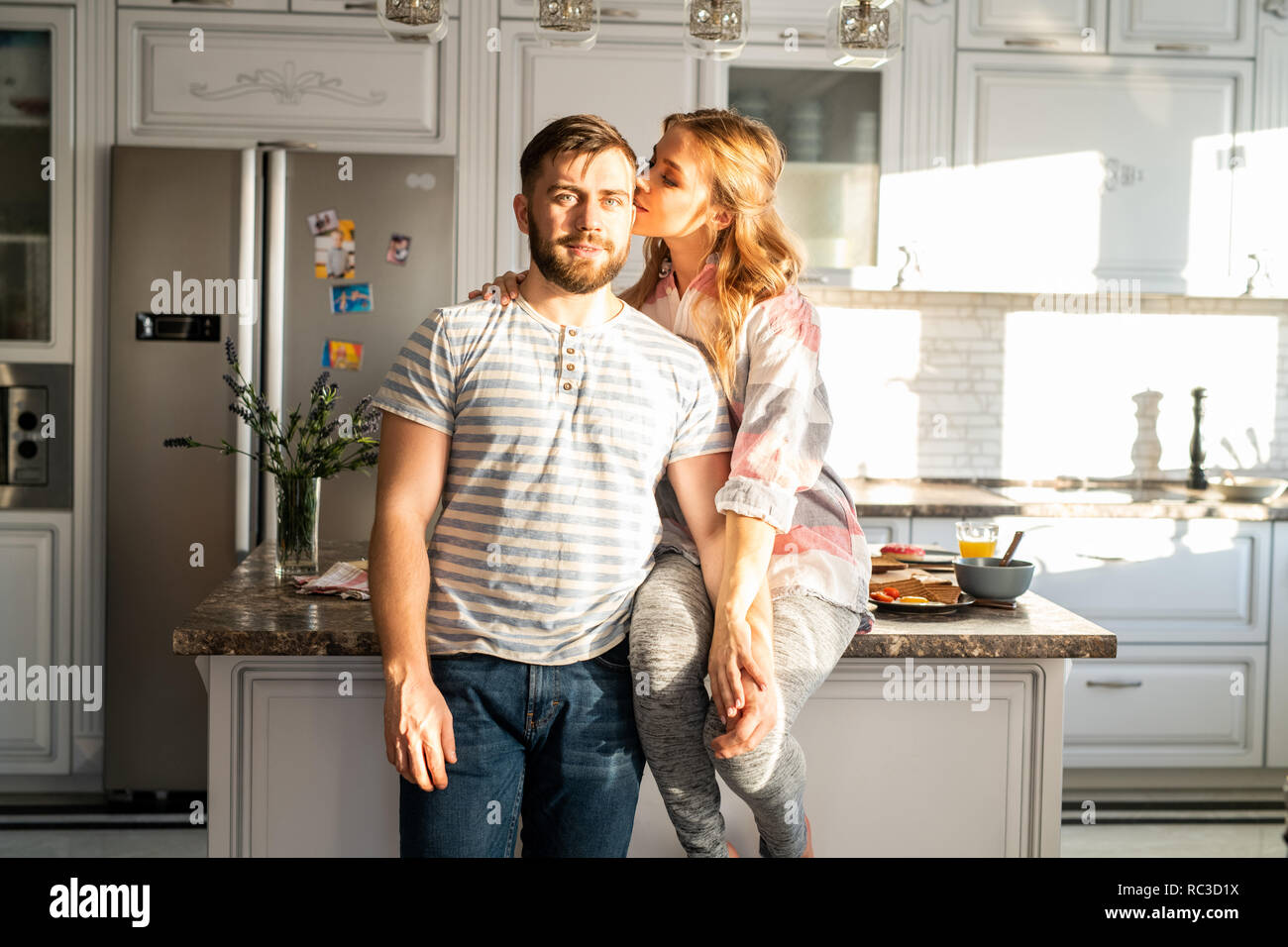 Happy Young Couple Posing at Home Stock Photo