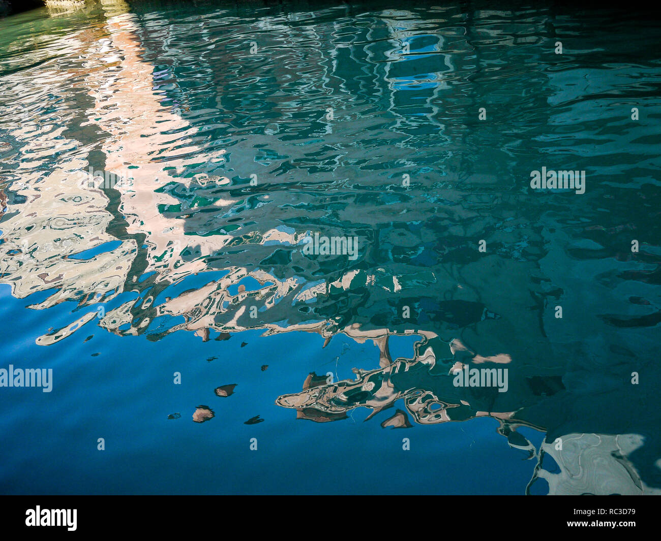 Reflections in the water of a canal, Venice, Veneto, Italy Stock Photo ...