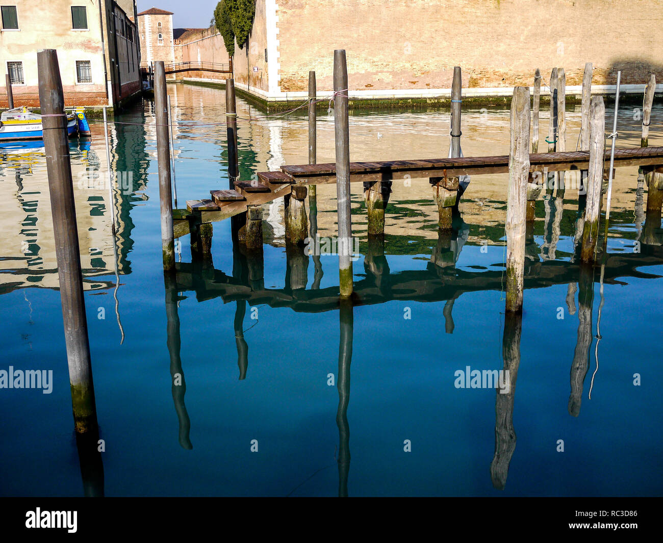Reflections in the water of a canal, Venice, Veneto, Italy Stock Photo ...