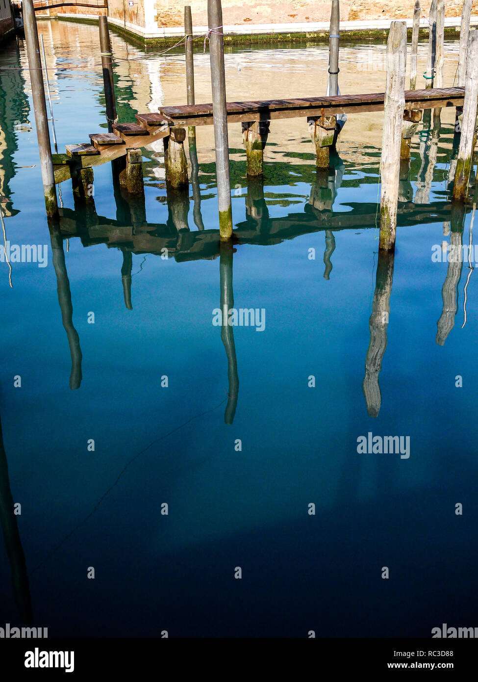 Reflections in the water of a canal, Venice, Veneto, Italy Stock Photo ...
