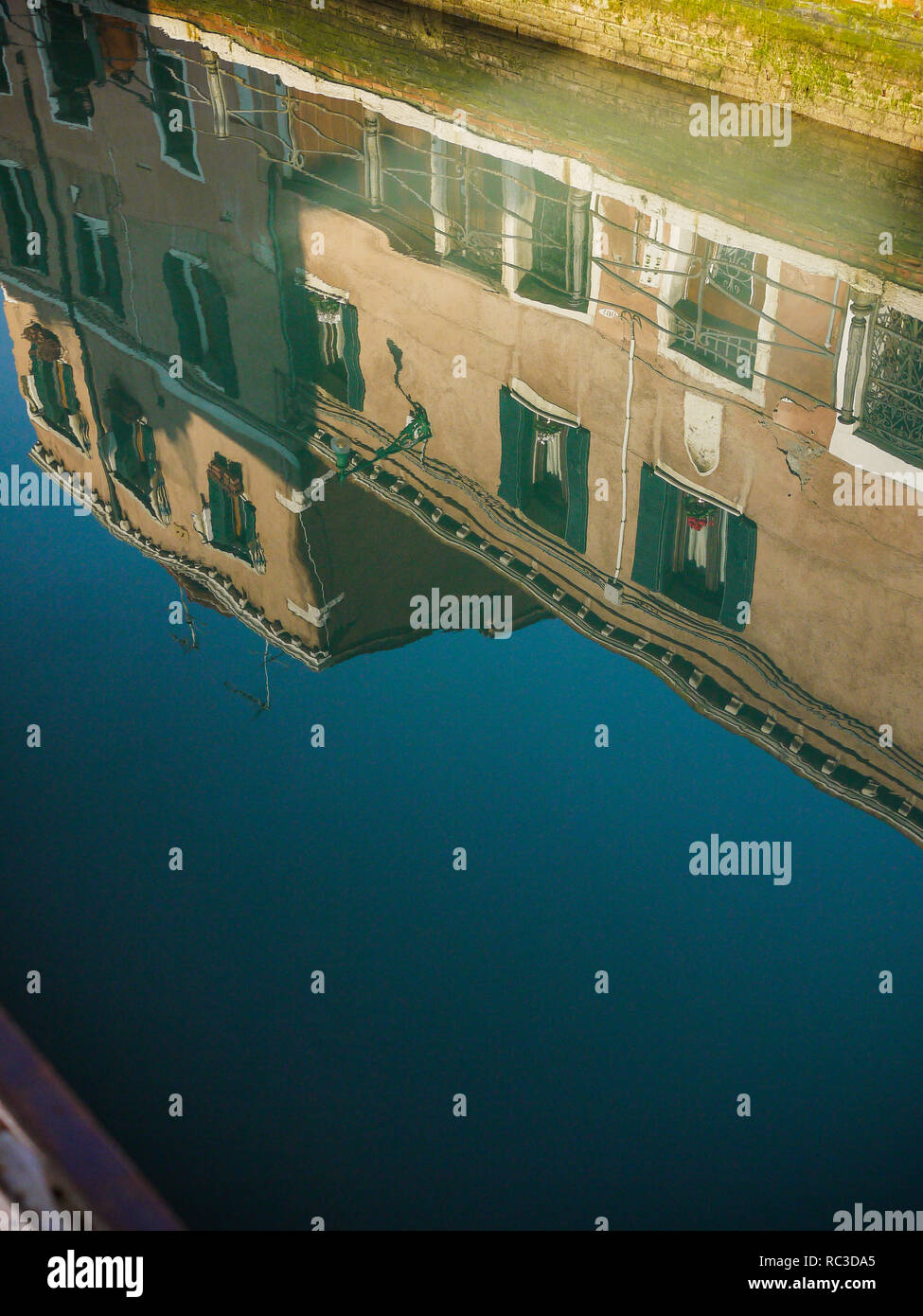 Reflections in the water of a canal, Venice, Veneto, Italy Stock Photo ...