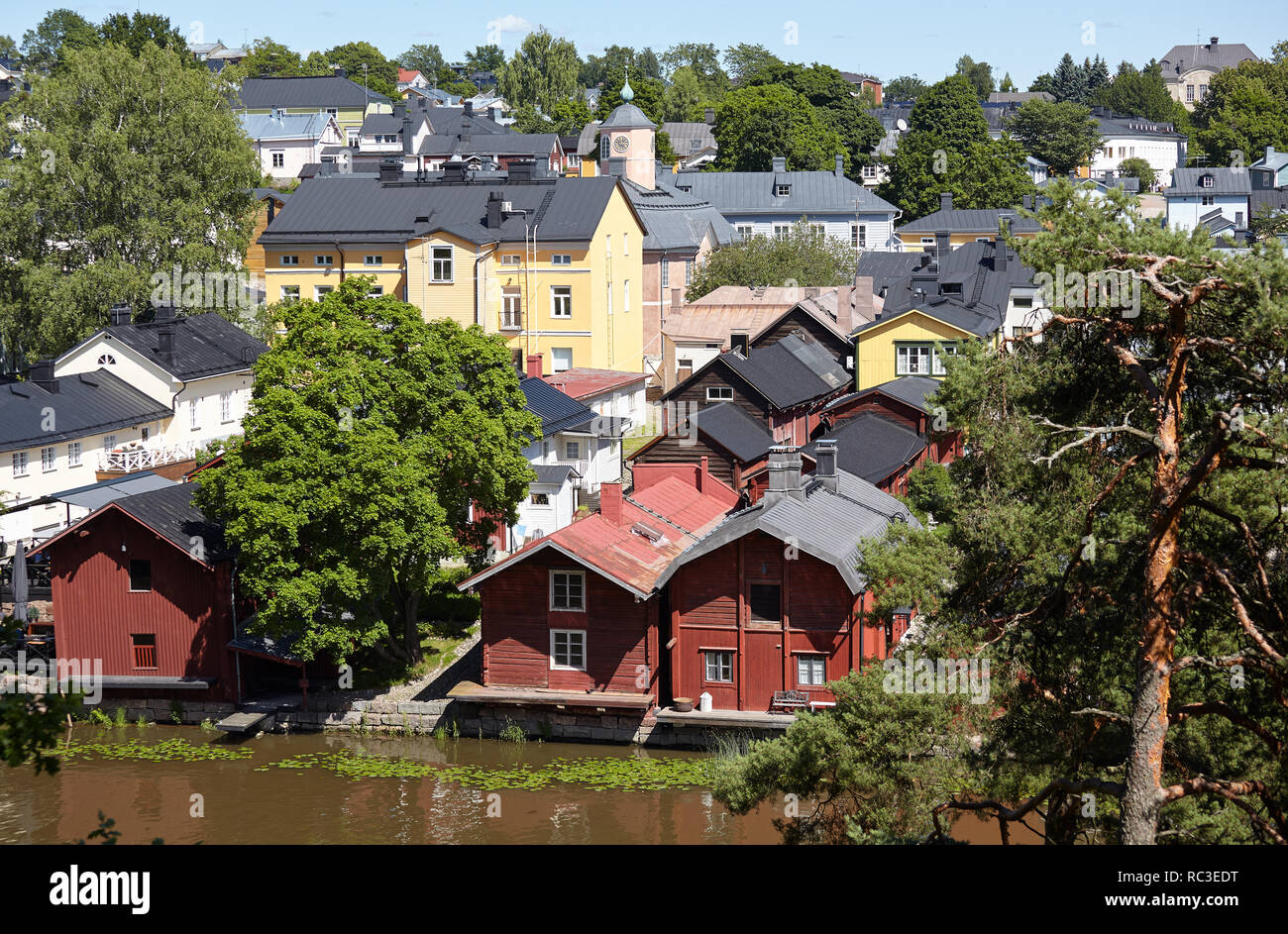 Porvoo, Finland - July 16, 2017: View to the river Porvoonjoki in the center of town. The red-colored wooden storage buildings on the riverside are a  Stock Photo