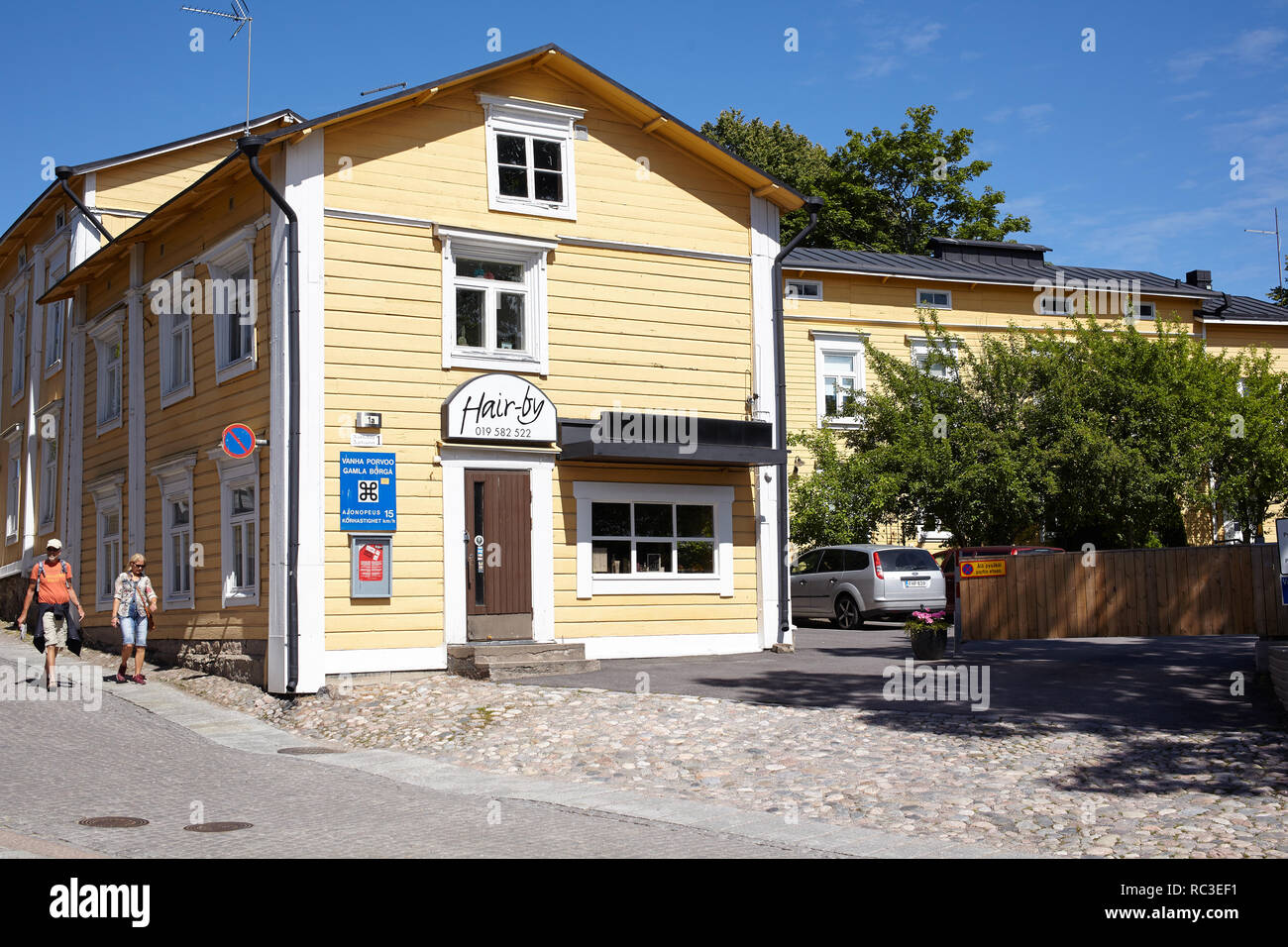 Porvoo, Finland - July 16, 2017: People at street sign of old town of Porvoo. Porvoo, Borga in Swedish, is one of the six medieval towns in Finland. Stock Photo