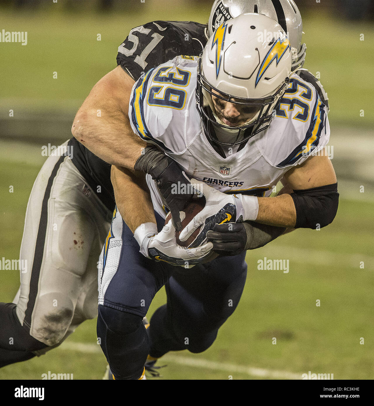 Oakland, California, USA. 24th Dec, 2015. Oakland Raiders inside linebacker Ben Heeney (51) tackles San Diego Chargers running back Danny Woodhead (39) on Sunday, December 24, 2015, at O.co Coliseum in Oakland, California. The Raiders defeated the Chargers 23-20. Credit: Al Golub/ZUMA Wire/Alamy Live News Stock Photo