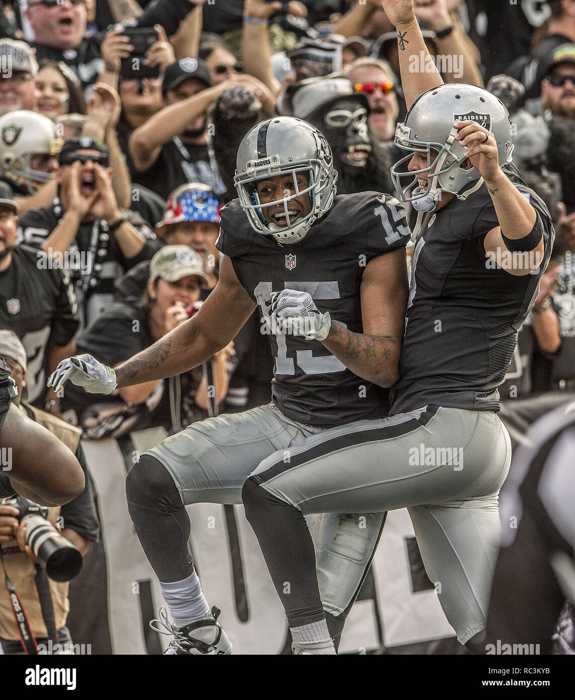 Oct 19, 2017; Oakland, CA, USA; Oakland Raiders wide receiver Michael  Crabtree (15) scores the game tying touchdown against the Kansas City  Chiefs during the fourth quarter at Oakland Coliseum. Ma …