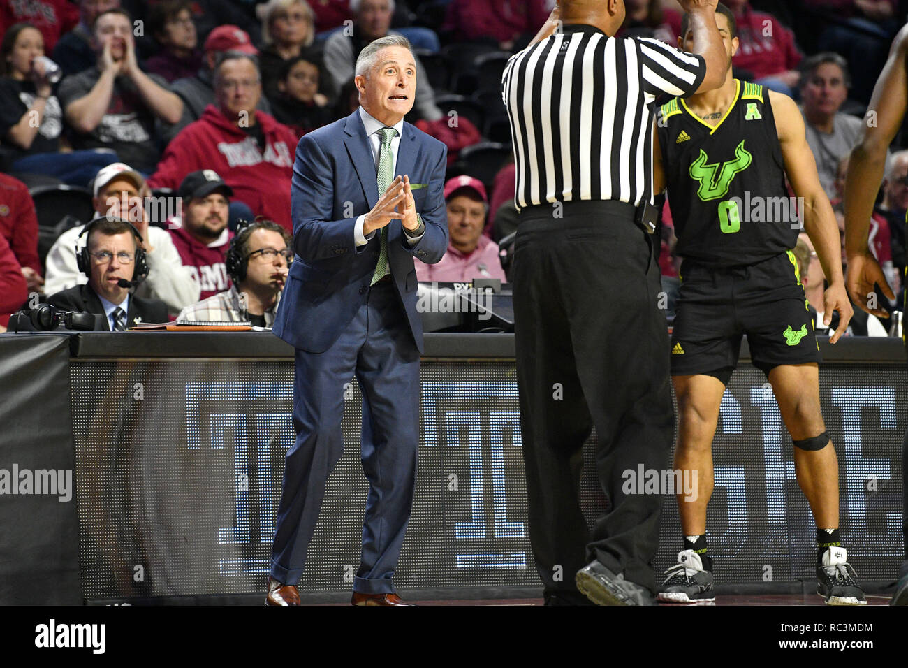 Philadelphia, Pennsylvania, USA. 12th Jan, 2019. South Florida Bulls head coach BRIAN GREGORY appears to plead for a call as an official signals a foul during the American Athletic Conference basketball game played at the Liacouras Center in Philadelphia. Temple beat USF in overtime 82-80 Credit: Ken Inness/ZUMA Wire/Alamy Live News Stock Photo