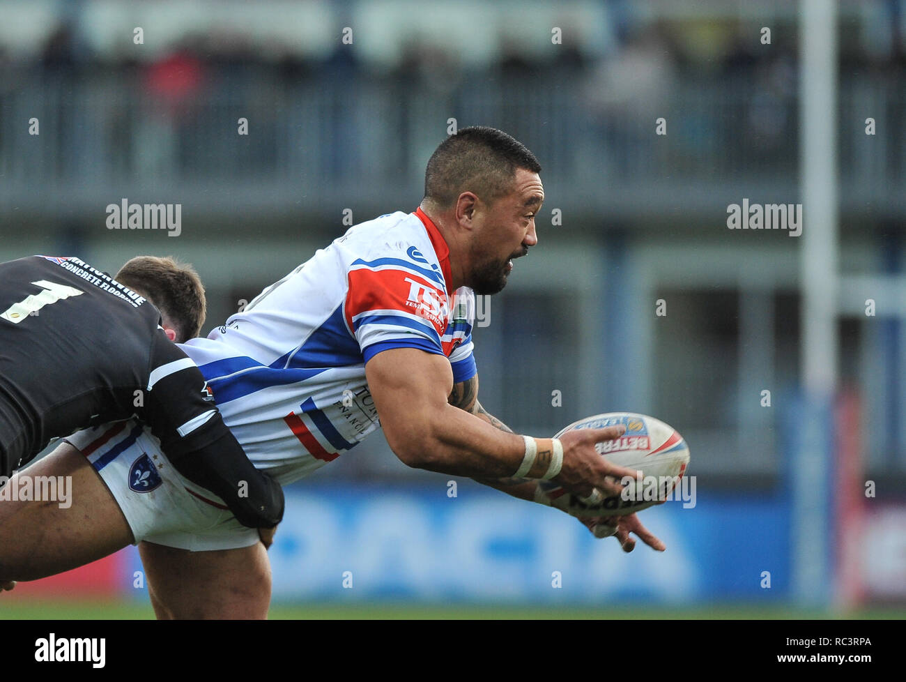 Wakefield, UK. 13 January 2019. Mobile Rocket Stadium, Wakefield, England; Rugby League Danny Kirmond and Danny Washbrook Testamonial, Wakefield Trinity vs Hull FC; Tinirau Arona of Wakefield Trinity offloads in tackle. Credit: Dean Williams/Alamy Live News Stock Photo