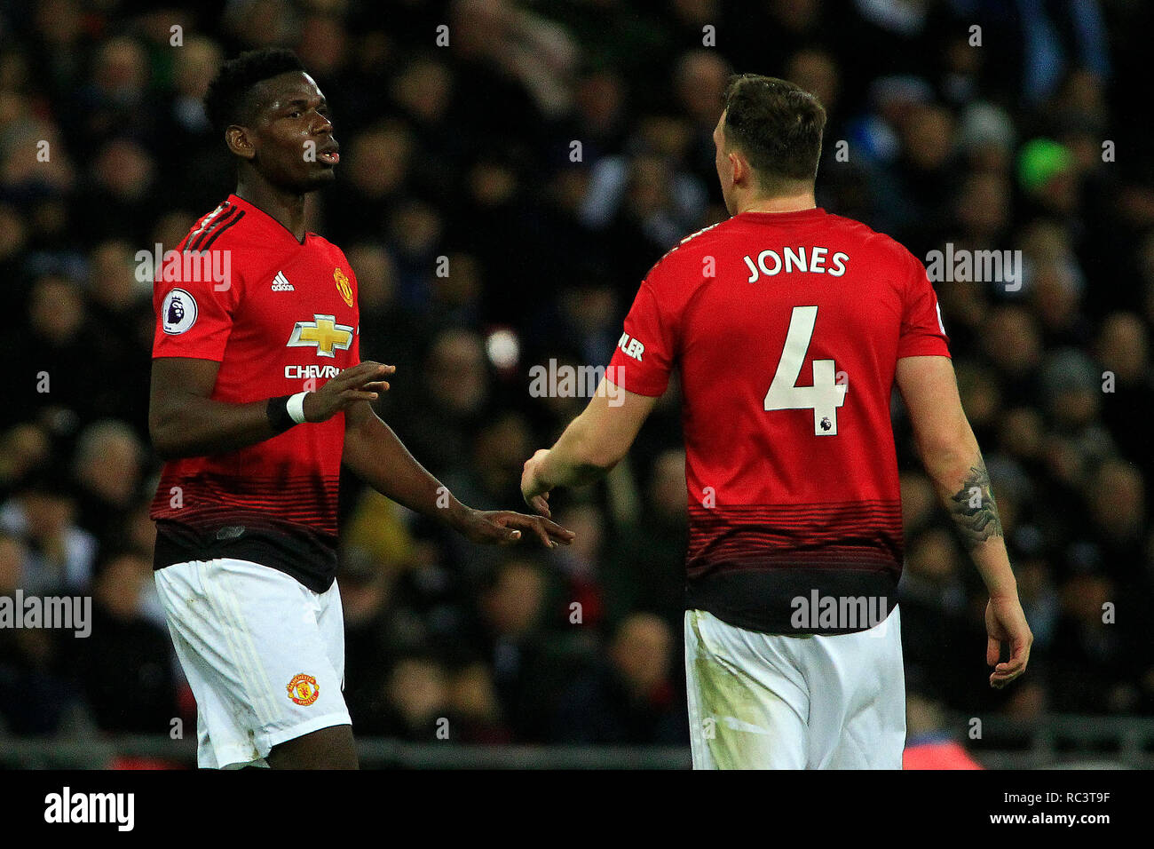 London, UK. 13th Jan, 2019. Paul Pogba (L) gives some instructions to Phil Jones of Manchester United (R). EPL Premier League match, Tottenham Hotspur v Manchester Utd at Wembley Stadium in London on Sunday 13th January 2019. this image may only be used for Editorial purposes. Editorial use only, license required for commercial use. No use in betting, games or a single club/league/player publications . pic by Steffan Bowen/Andrew Orchard sports photography/Alamy Live news Credit: Andrew Orchard sports photography/Alamy Live News Stock Photo