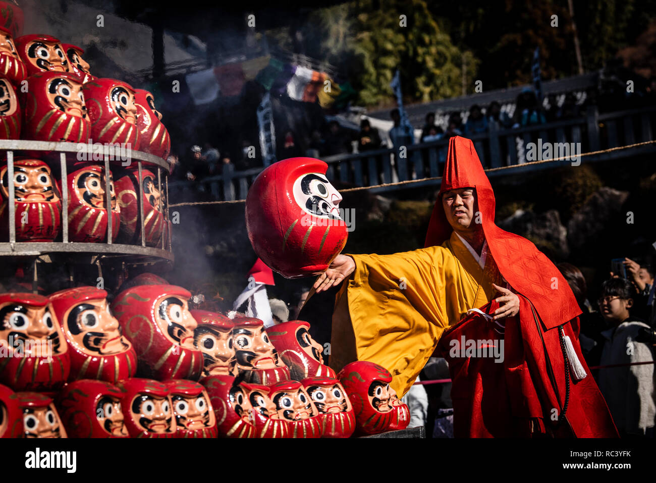 JANUARY 13, 2019 - A Buddhist monk tosses a Daruma doll on to a stack of burning dolls during a daruma kuy ceremony at Dairyuji, a Buddhist temple in Gifu, Japan. People burn 10,000 dolls from the previous year and buy new ones during the ceremony, one of the biggest of its kind in Japan. Daruma dolls typically symbolize goal setting, perseverance, and good luck. Credit: Ben Weller/AFLO/Alamy Live News Stock Photo