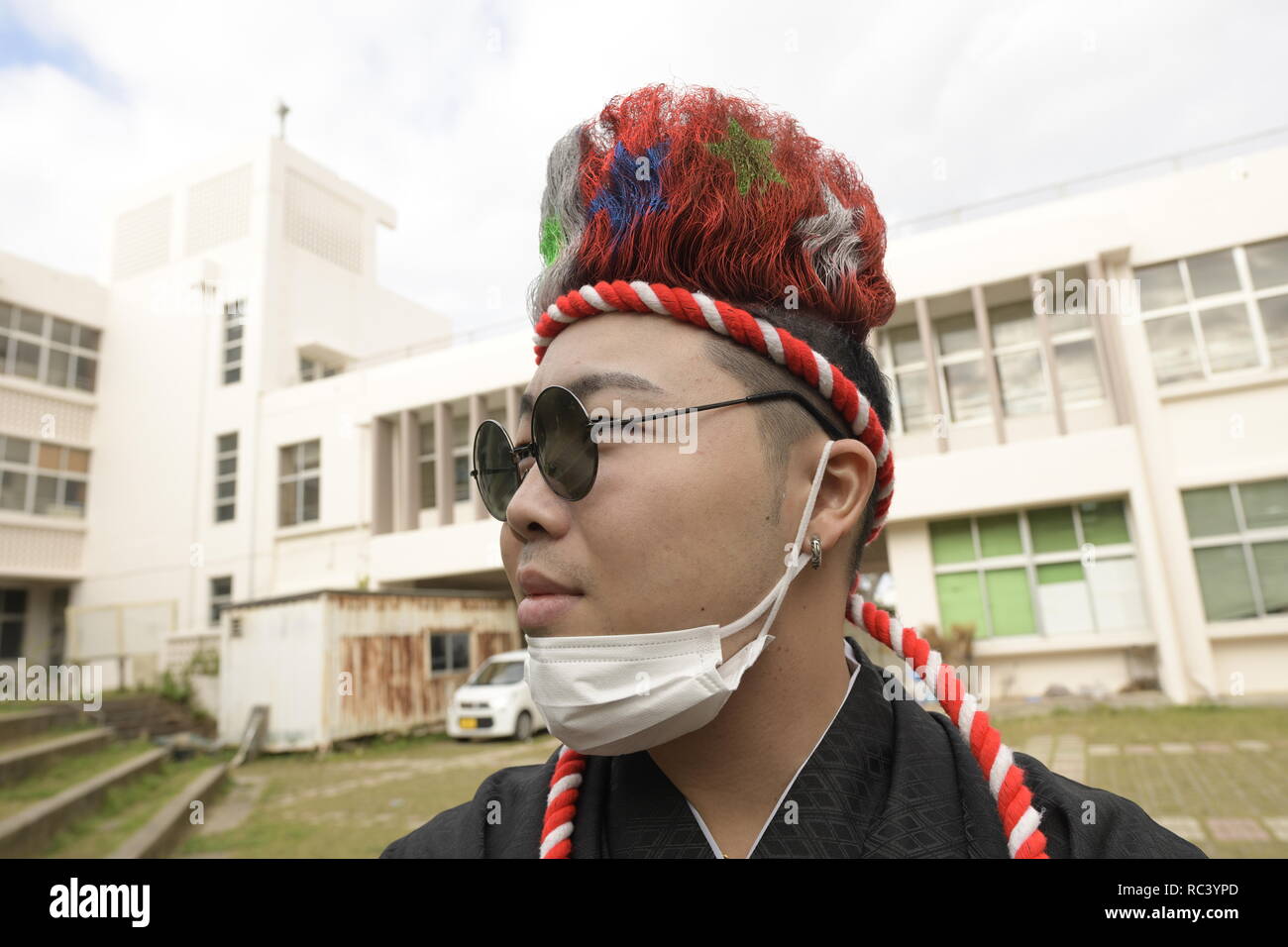 NAHA, JAPAN - JANUARY 13: An Okinawan man in a kimono poses for a ...