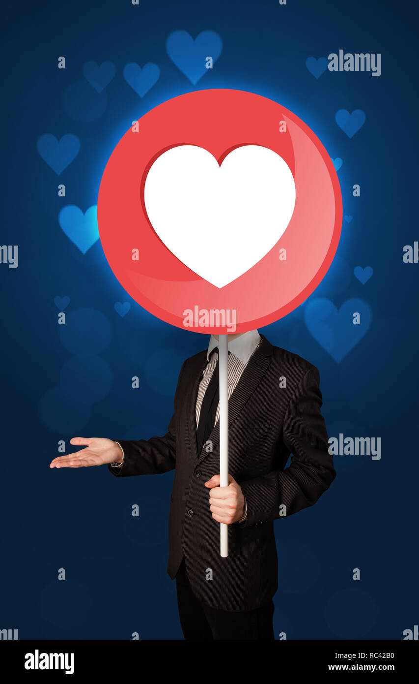 Smart businessman holding round sign with heart Stock Photo Alamy
