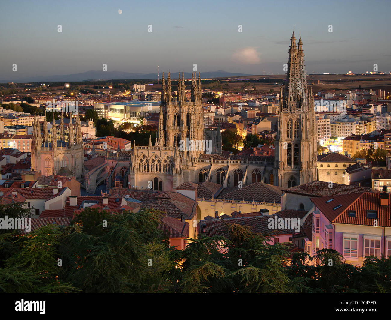 Time-blended sunset/night view over the city and cathedral of Burgos in Spain Stock Photo