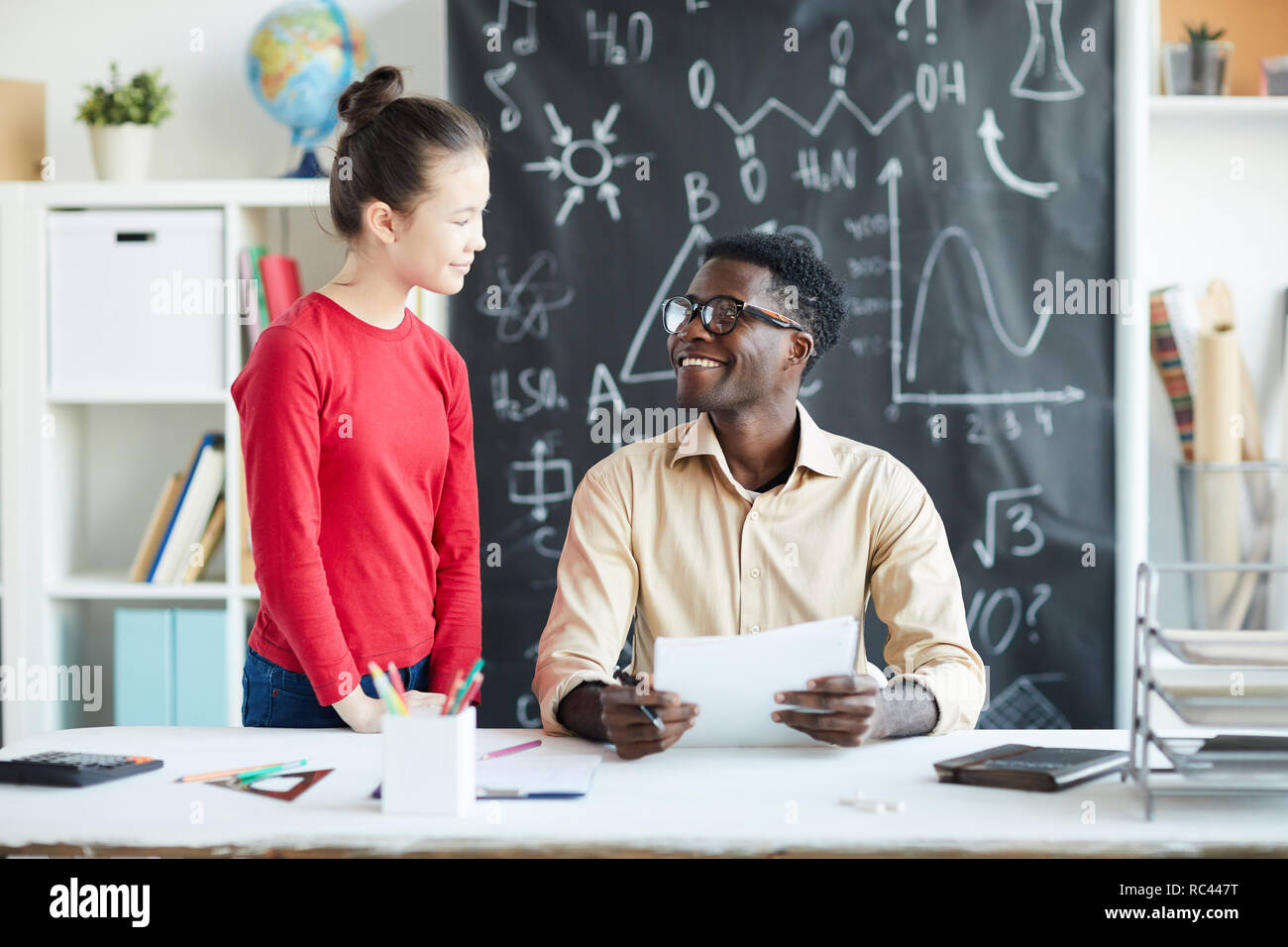 Consulting with teacher Stock Photo Alamy