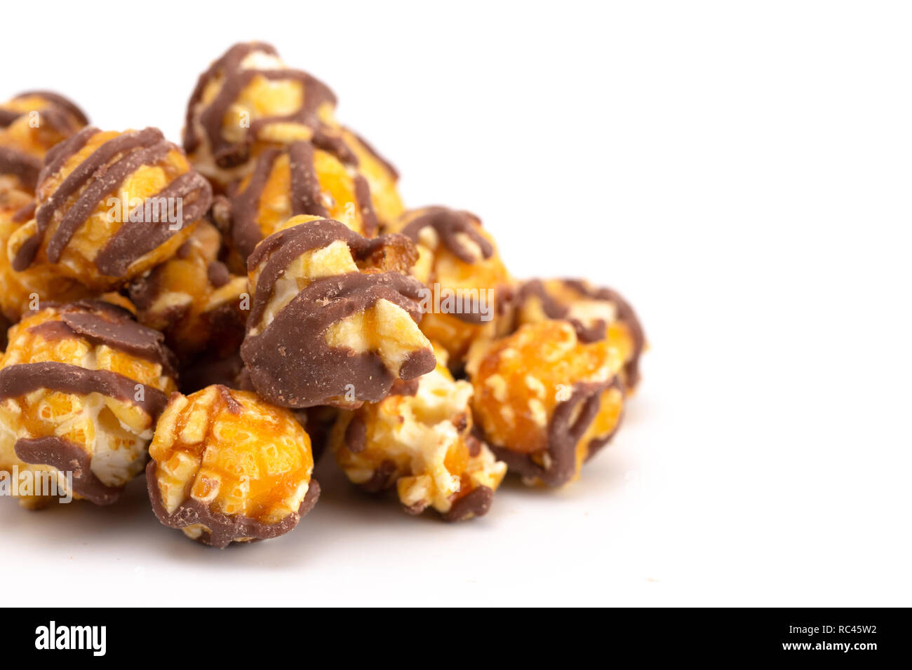 Chocolate Stripped Caramel Popcorn on a White Background Stock Photo