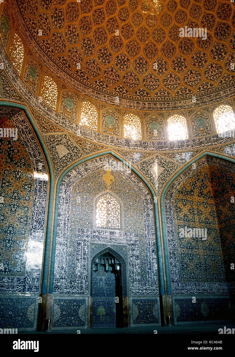 Islamic Art. Safavid era. Sheikh Lotf Allah Mosque. Built in 1598 during the reign of Abbas I and completed in 1602 in time of Sheikh Lotfollah. Mirhab and dome of the prayer hall covered with glazed tiles and writing of Ali Reza Abbasi. Isfahan. Islamic Republic of Iran. Stock Photo