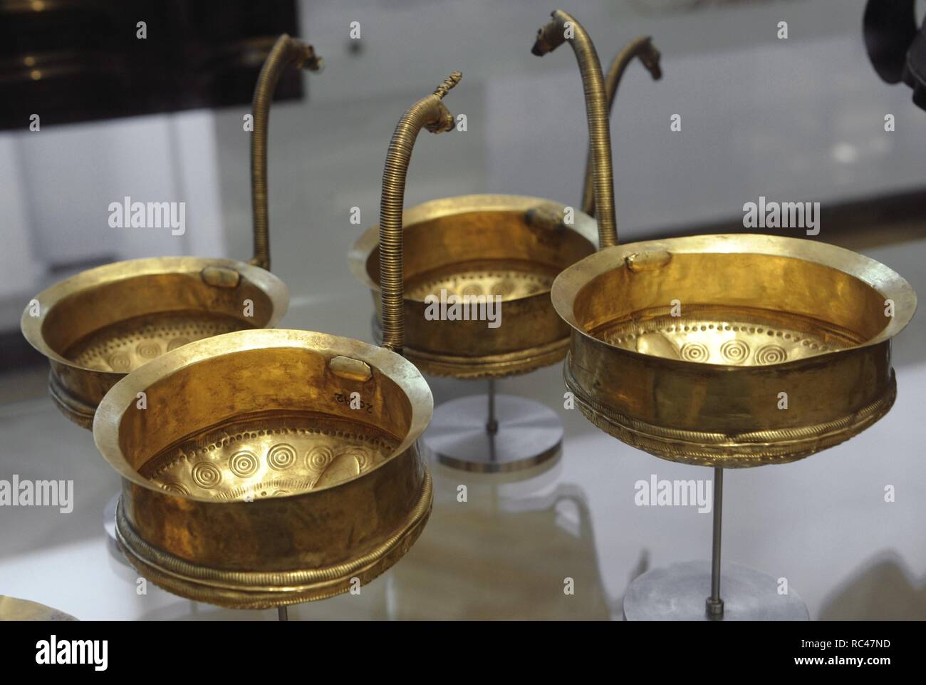 Art. Prehistory. Metal Age. Golden bowls, most with handle shaped like horses' heads, from an imported bronze vessel decorated with sun ships.  De Bog Mariesminde, Funen. 10th-6th Centuries BC. National Museum of Denmark. Copenhagen. Stock Photo