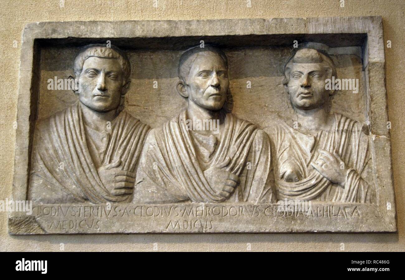 Roman Art. Funerary portrait. Marble. Relief from a tomb. It shows three family members From left: Clodius Tertius (the son), Clodius Metrodorus (the father) and, on the right, Clodia Hilara (presumably wife/mother). The term 'medicus' is refered to the profession of the two men. Last third of the 1st century B.C. Villa Taverna in Frascati belonging to the family of the Borghese princess. Louvre Museum. Paris. France. Stock Photo