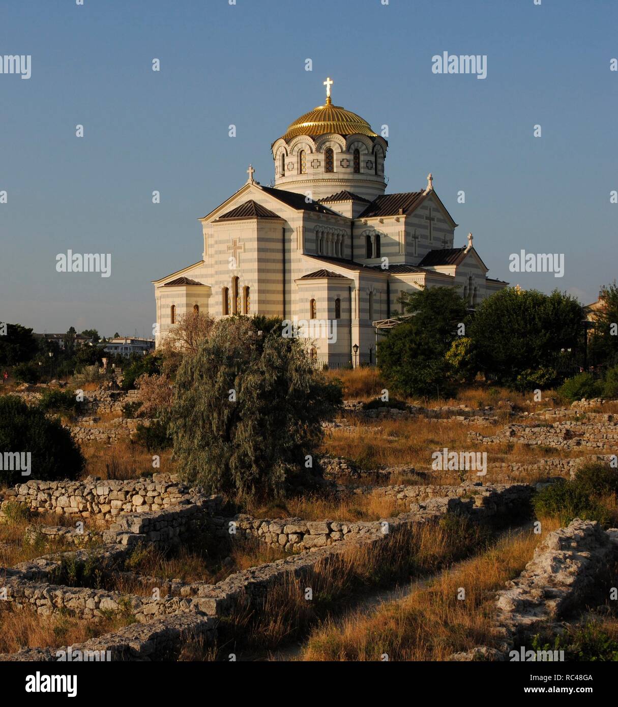Ukraine. Ruins of greek colony Chersonesus Taurica. 6th century BC. At background, Neo-Byzantine Russian Orthodox Church reconstructed at 21th century by E. Osadchiy. Sevastopol. Stock Photo