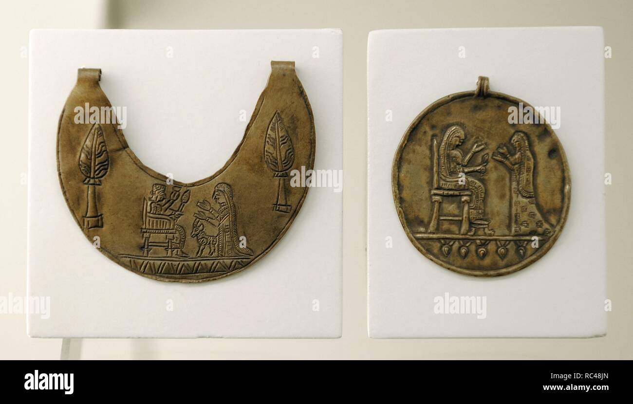 Urartu civilization. Pectoral and gold medallion decorated with reliefs ...