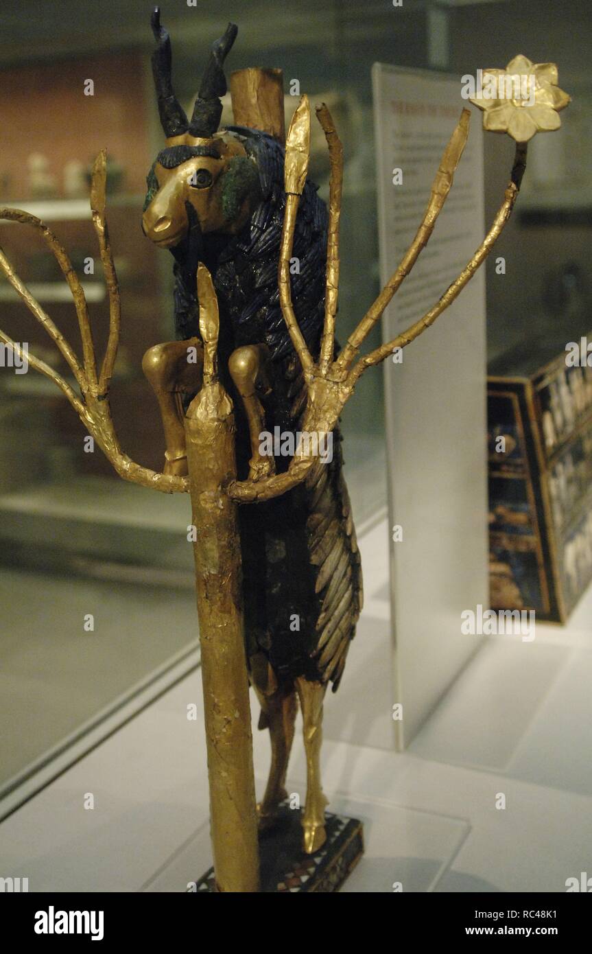 The Ram in a Thicket. Rampant Ram perched on the tree of life, covered with gold leaf. The horns, eyes and back of the animal are of lapis lazuli. The base on silver. Possibly served as a offerings pedestal or a harp motif. Found at a pit PG 1237 of the Royal Cemetery of Ur. 2600-2400 BC. British Museum. London. United Kingdom. Stock Photo