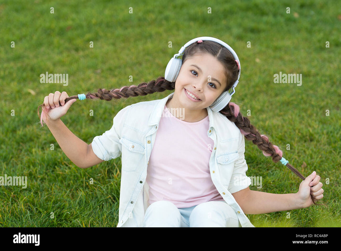 Listen to music. Beauty and fashion. Childhood happiness. Mp3 player.  childrens day. Audio technology. small kid listen ebook, education. small  girl child in headphones. Resting with joy Stock Photo - Alamy