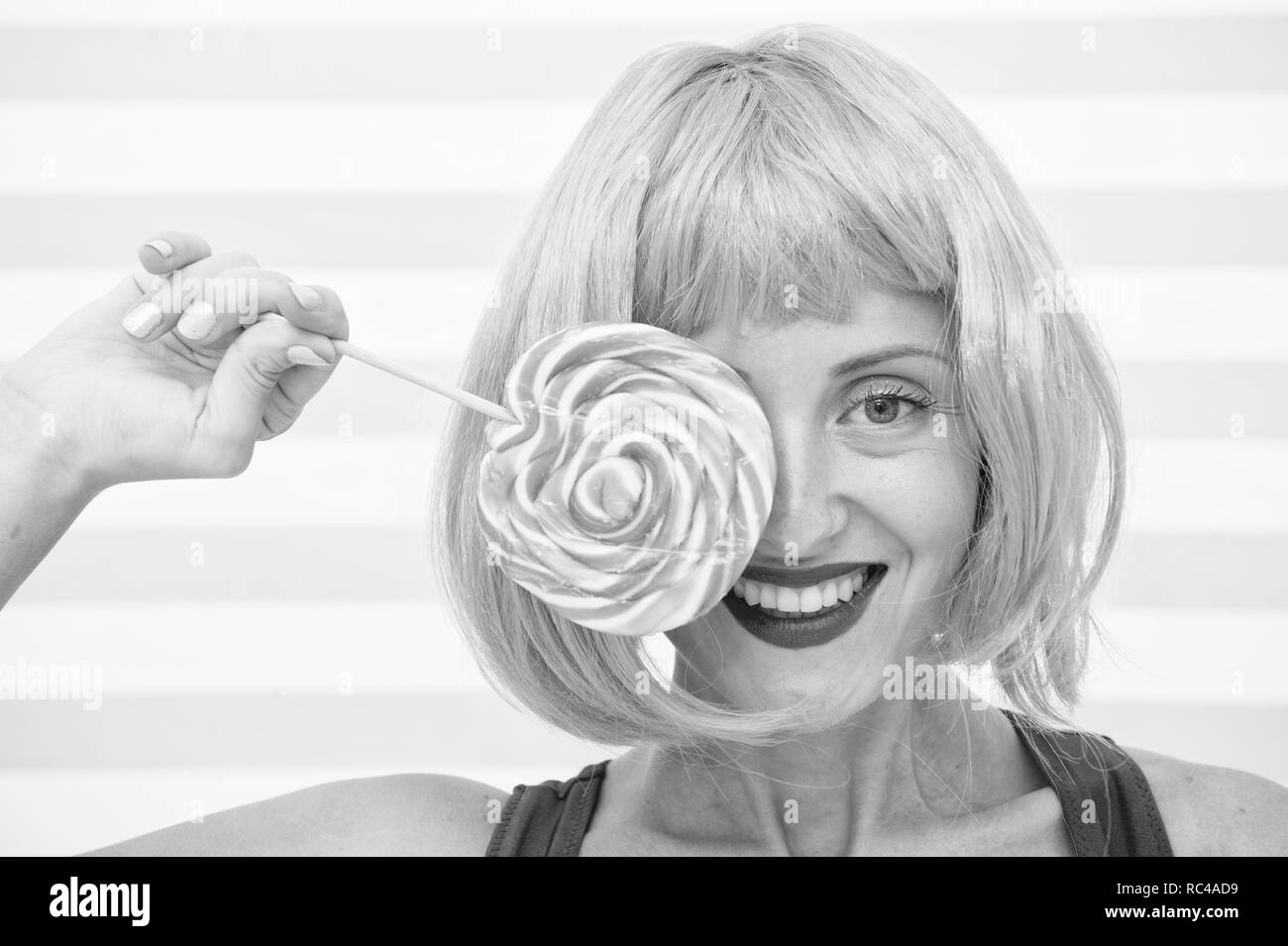 crazy girl with lollipop feeling happiness. happiness and fun. crazy girl have lollipop. sweet look. enjoying sweet lollipop. yummy kiss. sweet and extremely big. Stock Photo