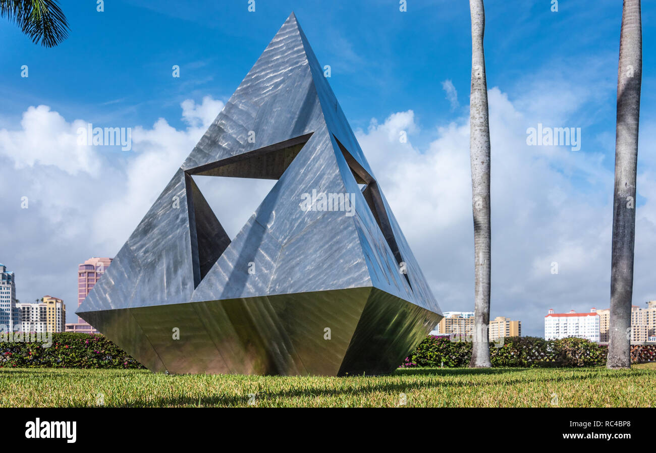 Intetra sculpture by Isamu Noguchi at the Society of the Four Arts in Palm Beach, with West Palm Beach, Florida city skyline in background. Stock Photo