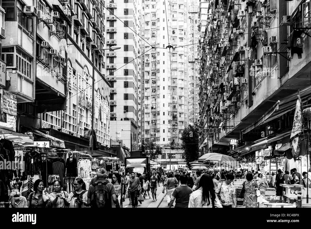 Hong Kong, China - October 13 2018: A large crowd walk in the Chun Yeung Street market in North Point in Hong Kong island through stall amid large apa Stock Photo