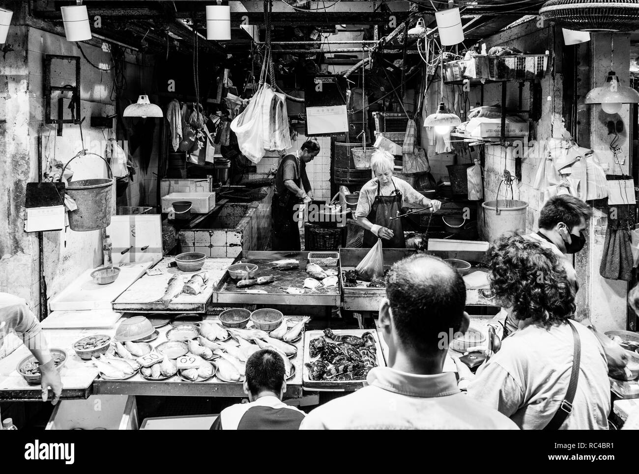 Hong Kong, China - October 13 2018: People buying seafood at the the Chun Yeung Street market in North Point in Hong Kong island. This is a traditiona Stock Photo