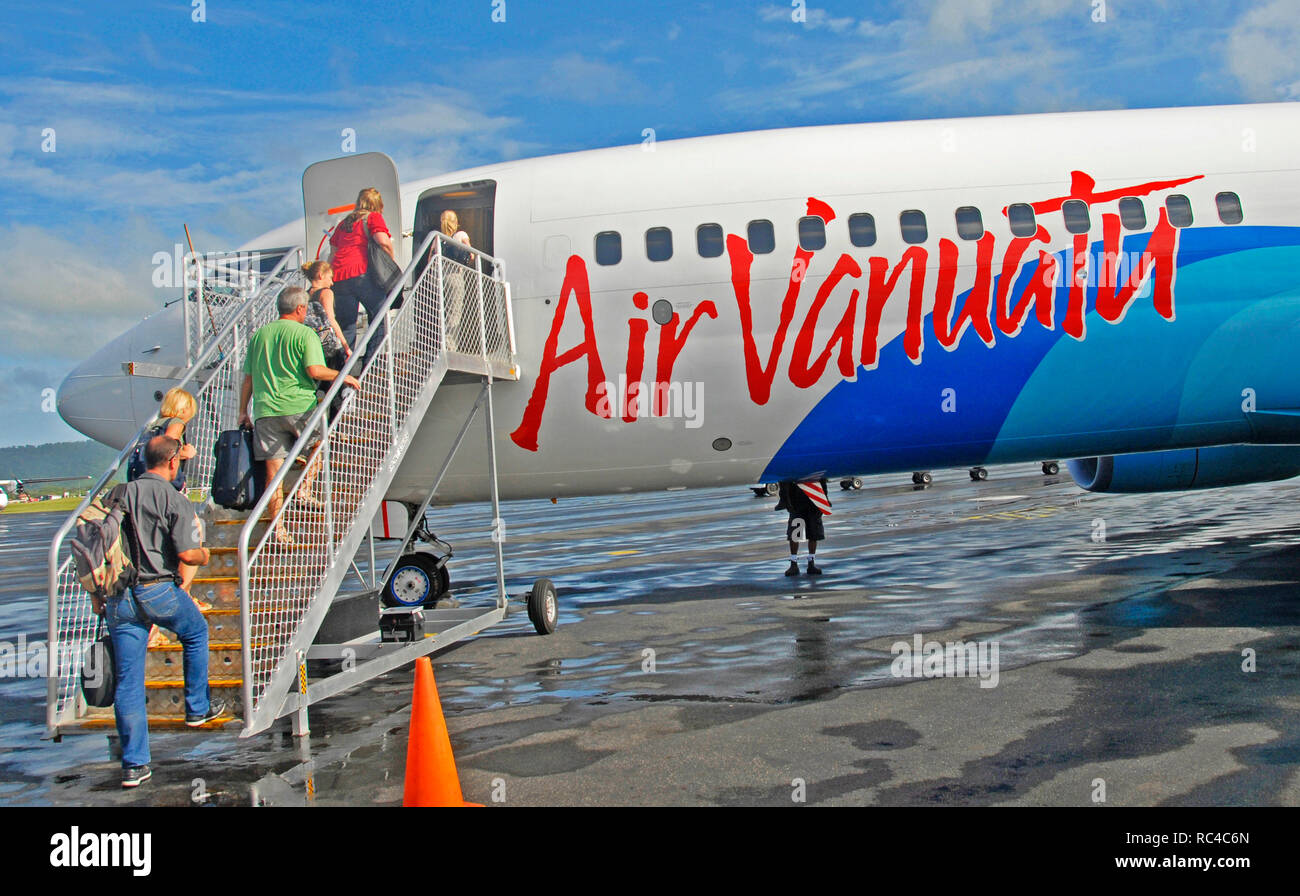 passengers boarding a 737 Boeing of Vanuatu airlines, Port Vila international airport, Efate island, Vanuatu Stock Photo