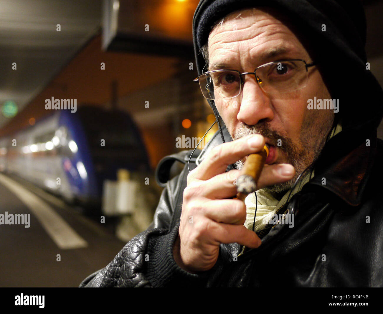 Man smoking a cigar while waiting for a train, Dijon Railway station,  Burgundy, Cote d'Or, France Stock Photo - Alamy