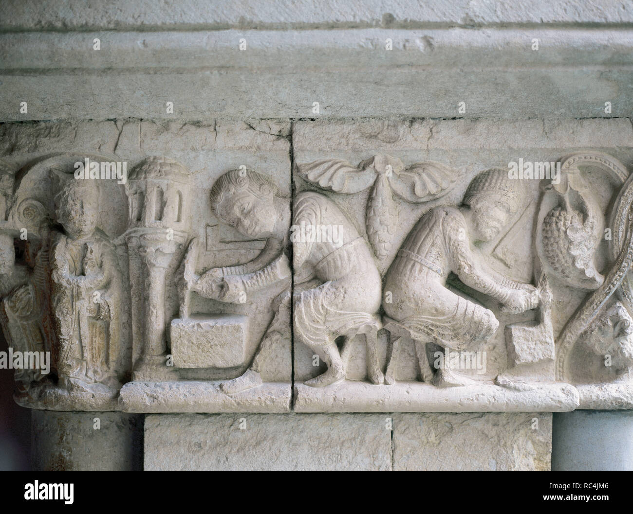Romanesque art. 12th Century. Stonemason and farmer. Detail of a capital of the Cathedral of Girona. Catalonia. Spain. Stock Photo