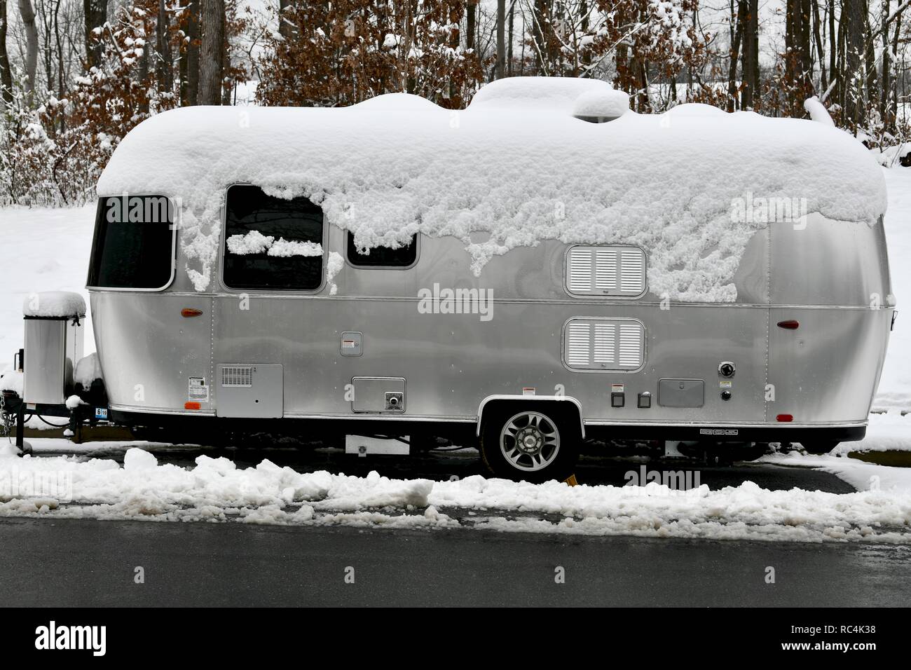 Airstream trailer covered in snow Stock Photo Alamy