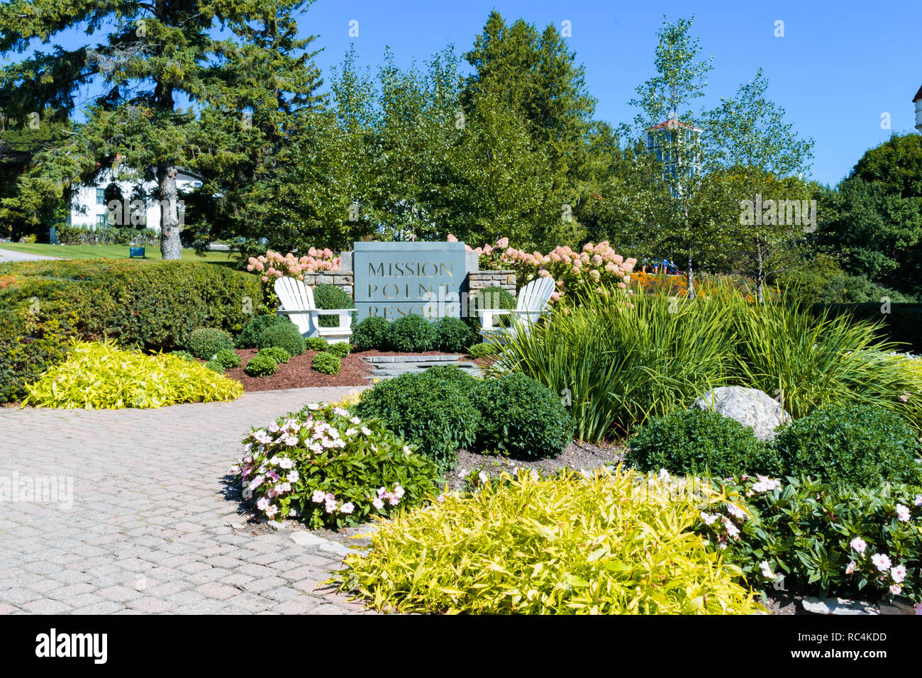 Mackinac Island, Michigan / United States - September 17, 2018: Flower gardens and sign of Mission Point Resort Stock Photo